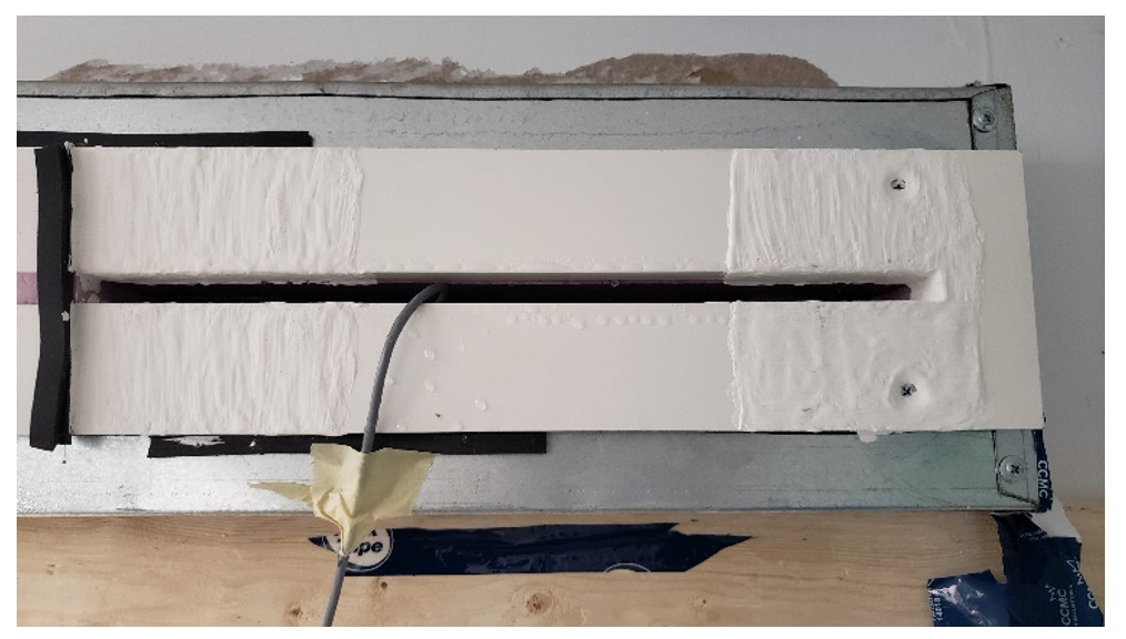 Figure 4: Image showing lack of condensation on area of diffuser with three coats of anti-condensation paint applied (left side). The right side with a single coat of paint did not have condensate but did have moisture accumulation observed by touch.