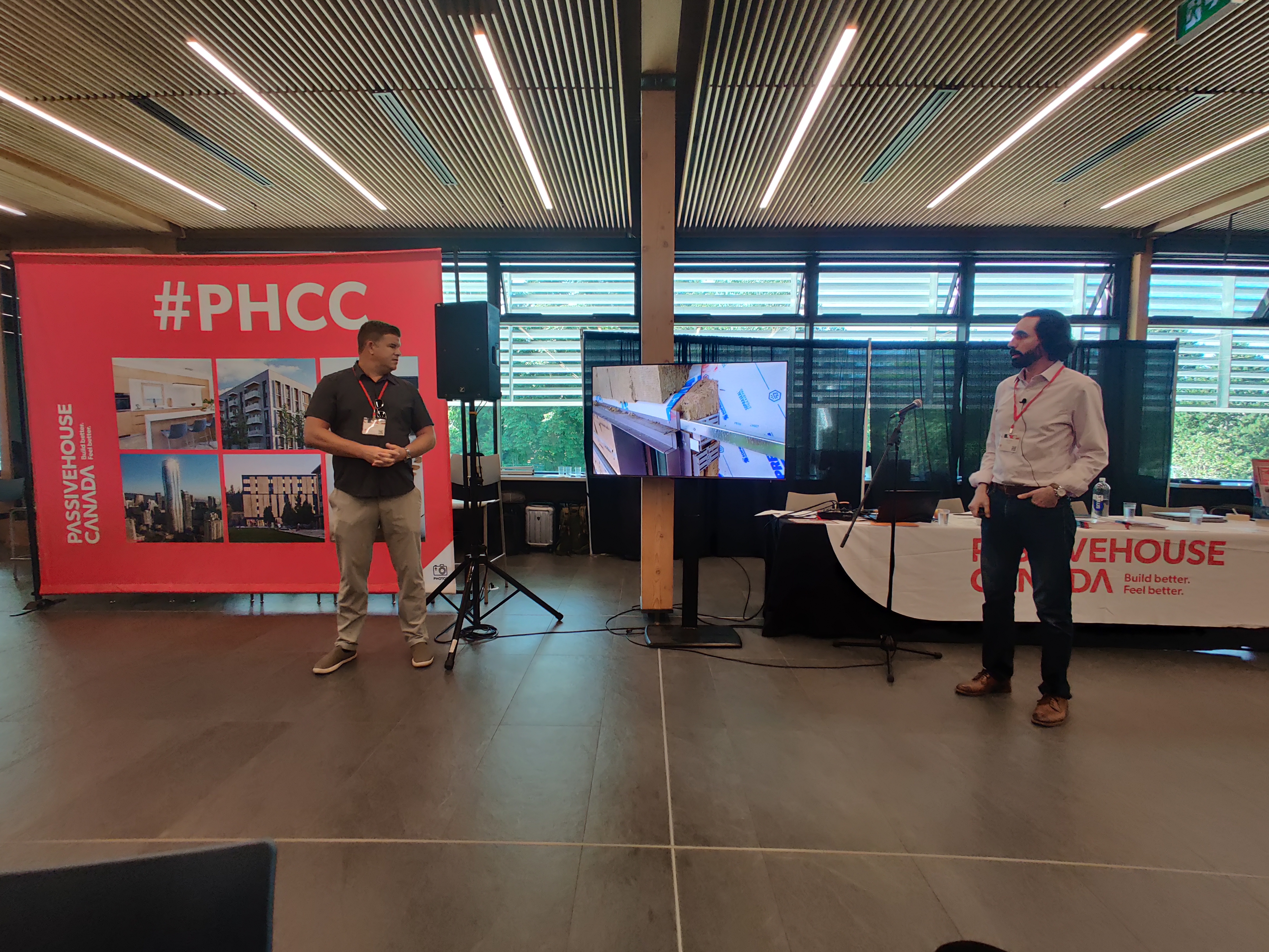 RDH Senior Building Science Specialist Graham Finch (left) and Perkins&Will Principal Alex Minard (right) speaking about the project at the Passive House Canada Conference in June 2024. Photo courtesy of Mahnaz Nikbakht