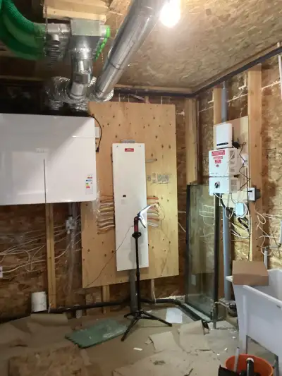 The mechanical room showing Jablatron ERV and Solaredge inverter before interior insulation