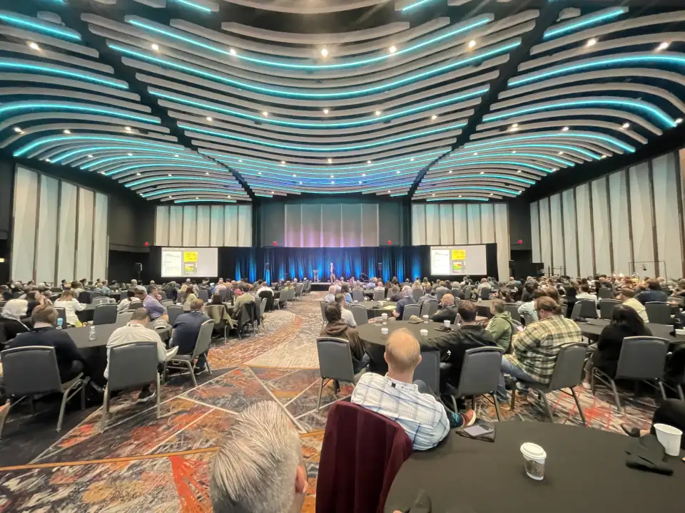 Tom Bassett-Dilley of Tom Bassett-Dilley Architects delivers his keynote address to PhiusCon at Milwaukee's Baird Center on October 7, 2025. Photo courtesy of Michael Ingui