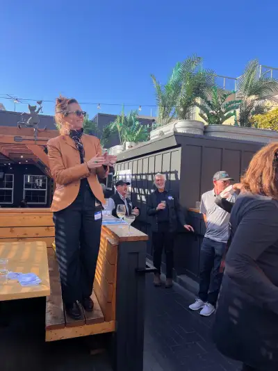 B.PUBLIC CEO and co-founder Edie Dillman attempts to speak over mariachi music. Photo courtesy of Bronwyn Barry.