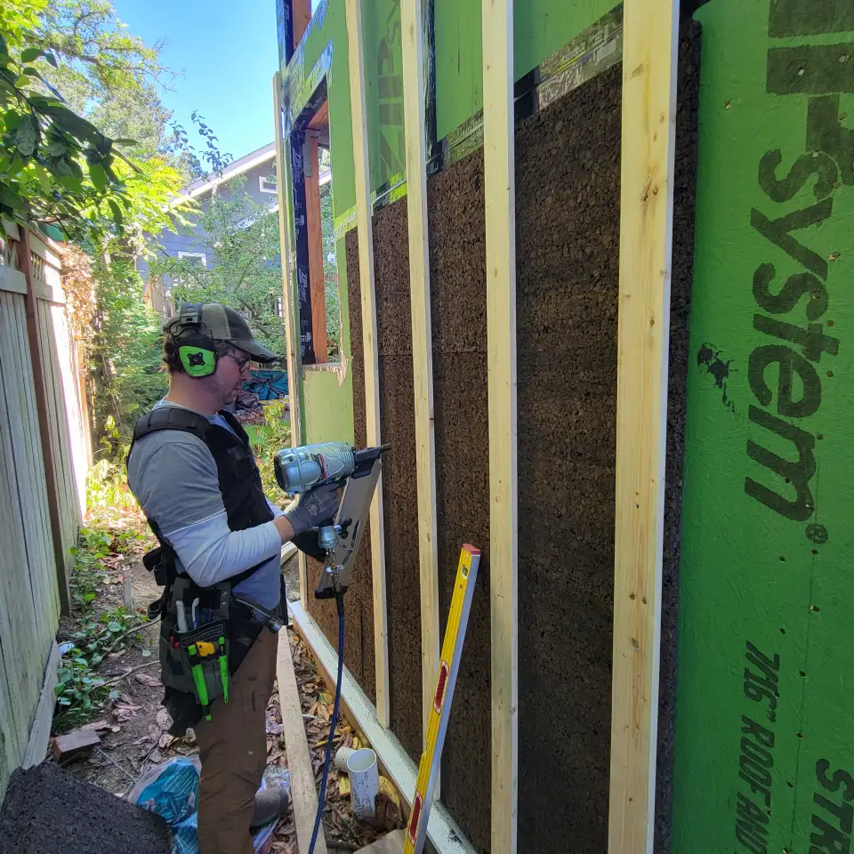 Installing the 1x4 rainscreen battens to hold the rigid cork board. Photo courtesy of Sean Conta.